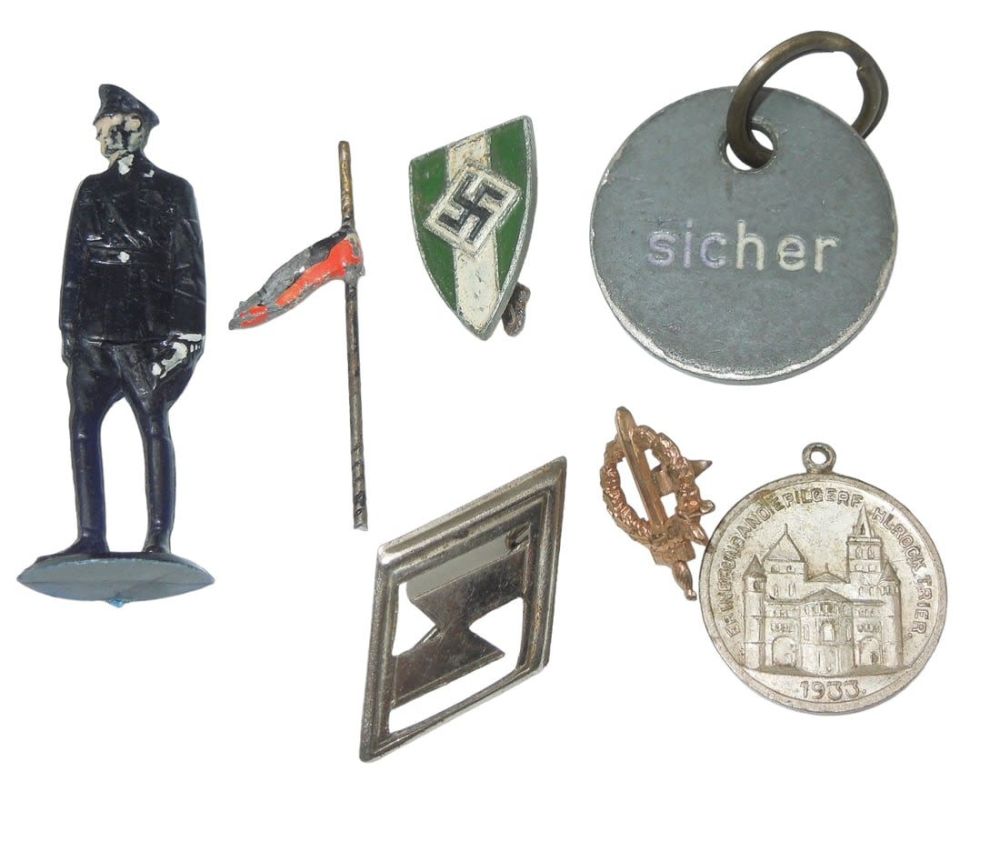 Lot 275: WWII German Military Tinnies & Pins Lot Toy SS Soldier
