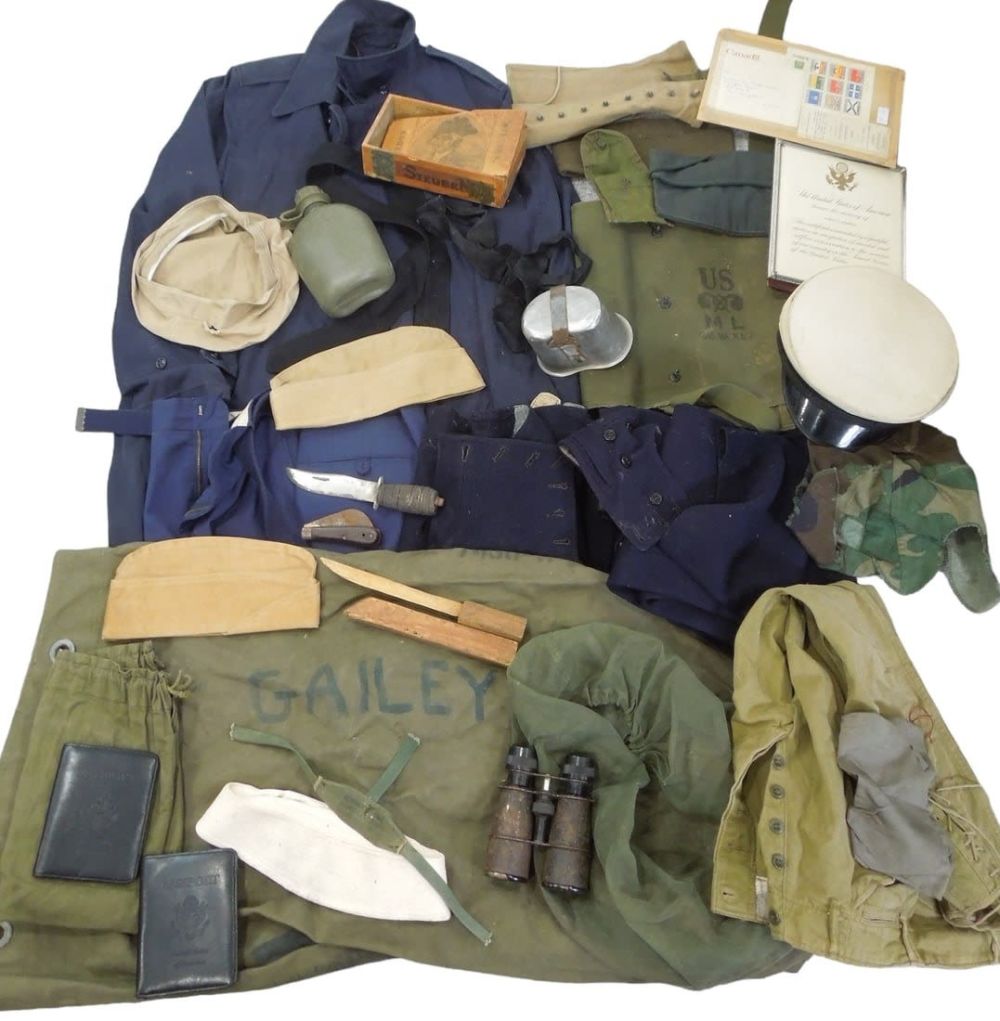 Lot 180: Huge Lot WWII - Vietnam Uniforms Knives Field Gear Binoculars