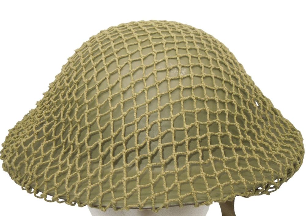 Lot 324: WWII British or Canadian MK Helmet With Camo Net