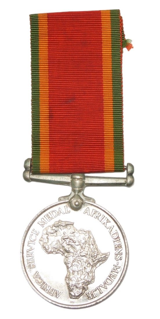 Lot 368: WWII British Africa Service Medal Named To Soldier on Rim