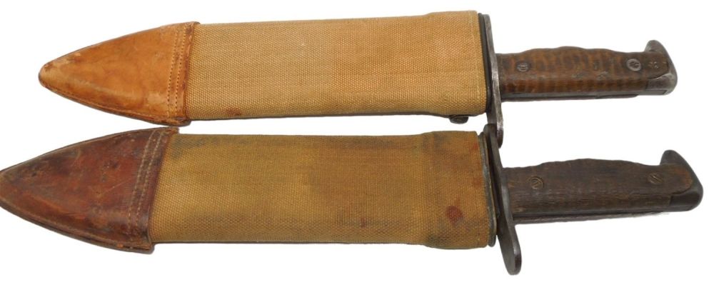 Lot 527: Lot (2) WWI US Army 1918 Plumb Bolo Knives & Canvas Scabbards