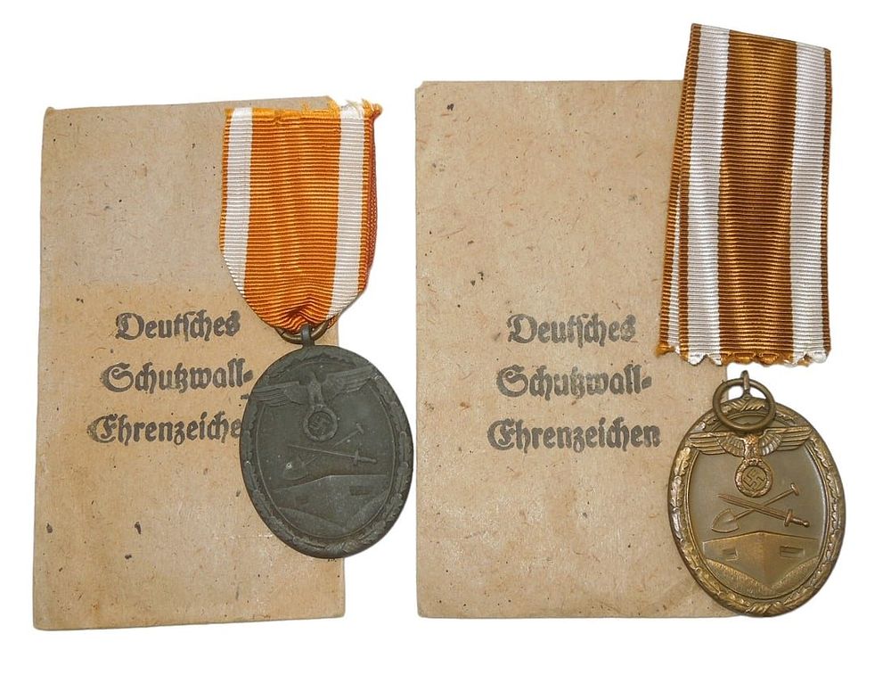 Lot 457: Lot (2) WWII German Army West Wall Medals & Envelopes