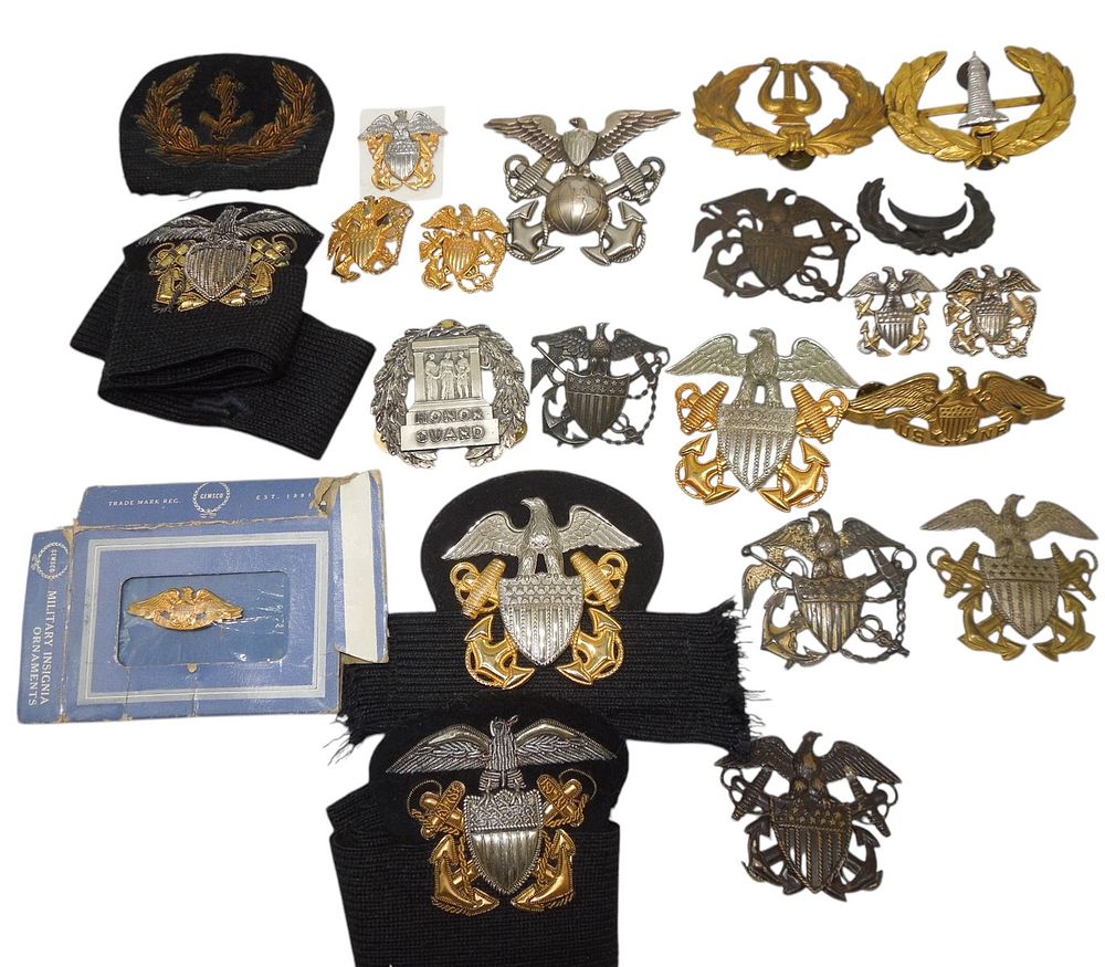 Lot 142: Collection WWII - Vietnam US Naval Cap & Breast Badges Insignia