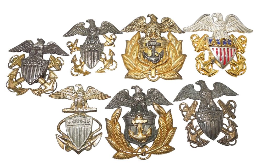 Lot 166: Lot (7) WWII US Navy & Merchant Marine Officer Cap Badges