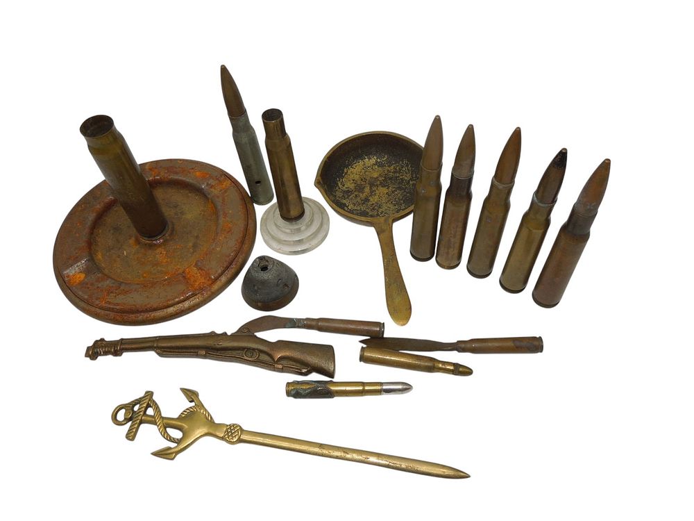 Lot 203: WWII - Vietnam Inert US Military Trench Art Pieces