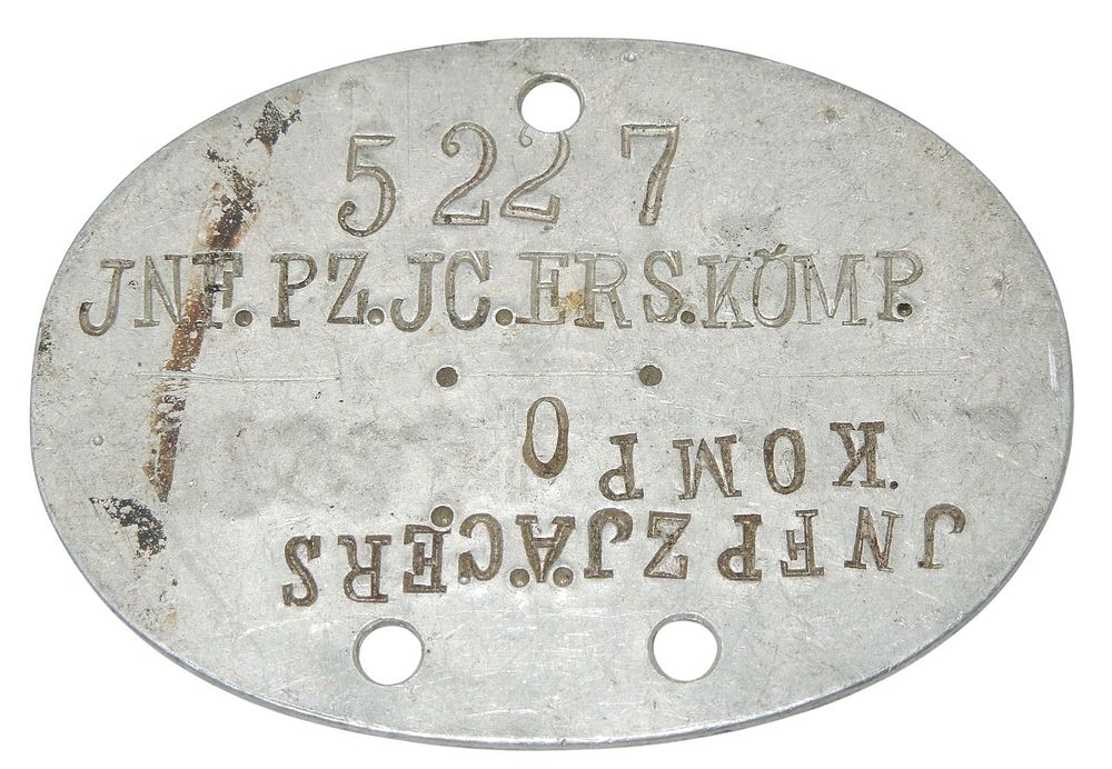 Lot 149: WWII German Army Panzer Soldier Unit Marked Dog Tag