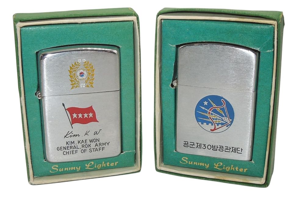 Lot 302: 1960s South Korean Air Force & Army General Presentation Lighters