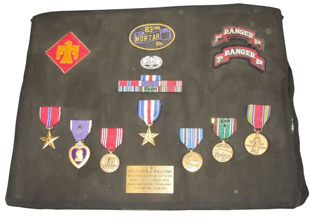 Lot 306: WWII 45th Division 83rd Chemical Mortar Silver Star Purple Heart Named Medal Group