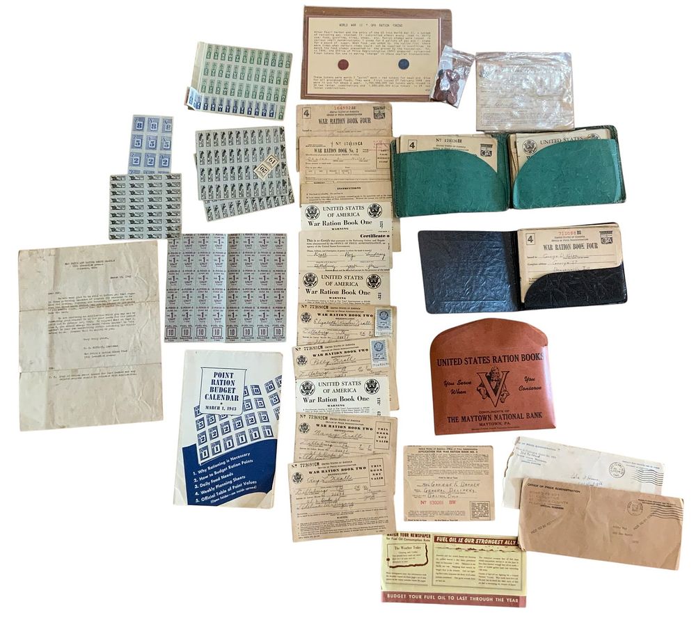 Lot 230: WWII Era Home Front Huge Lot Ration Books, Holders, Tokens, Ration Chart