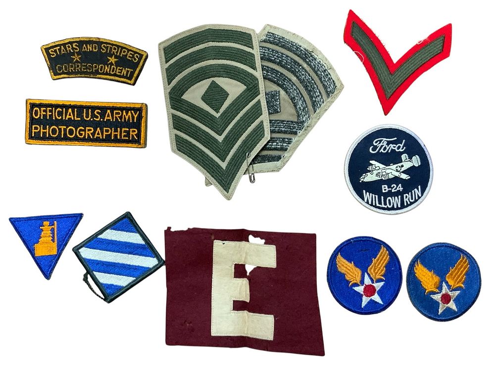 Lot 232: WWI-Post War Patches Engineer, B-24 Liberator, Stars & Stripes Correspondent, Photographer plus