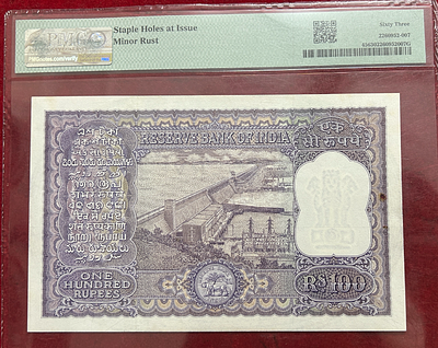 100 Rupees Big size note governer, P.C.Bhatacharya PMG grading 63….Rare Note