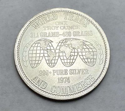 1974 World Trade & Commerce 1 ozt .999 Silver. Winner shall receive the exact coin shown here. (BD/B)