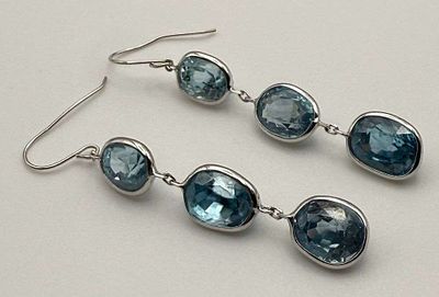 14k White Gold Dangle Earrings W/ 14ct Blue Zircons. Winner shall receive the exact item shown