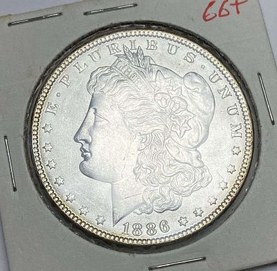1886 Morgan Silver Dollar MS66+. Winner shall receive the exact coin shown here. (RR/B)