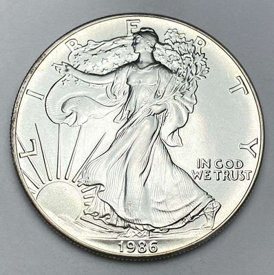 First Year High Grade 1986 American Silver Eagle. Winner shall receive the exact coin shown 