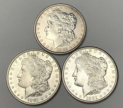 1881-S-1882 Morgan Silver Dollars MS62-MS65 (3-coins). The 1881-S is MS65, the 1881-O is MS62 