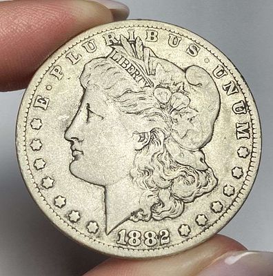 1882-CC Morgan Silver Dollar VF. Winner shall receive the exact coin shown here. (RR/B)