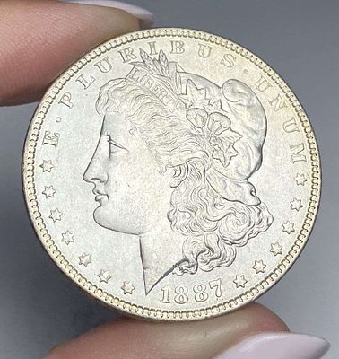 1887 Morgan Silver Dollar MS66. Winner shall receive the exact coin shown here. (RR/B)