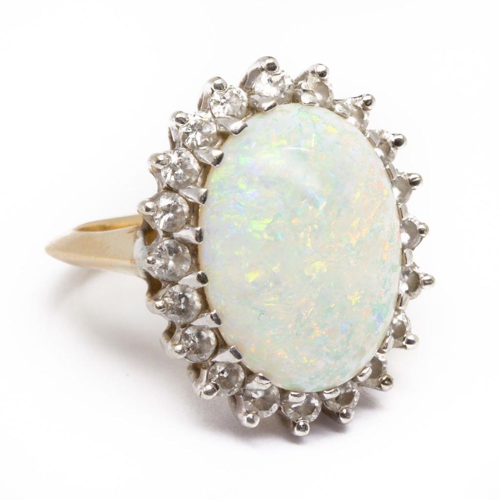 Lot 200: GIA opal Ring set with large cabochon opal surrounded