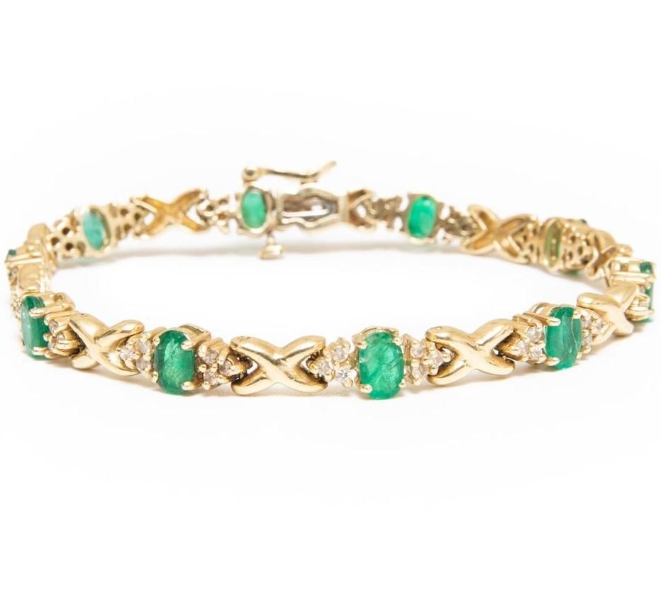 Lot 202: GIA Gold and emerald bracelet with diamonds 7"
