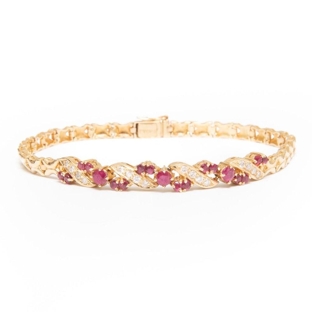 Lot 263: GIA 14k gold ruby and diamond bracelet