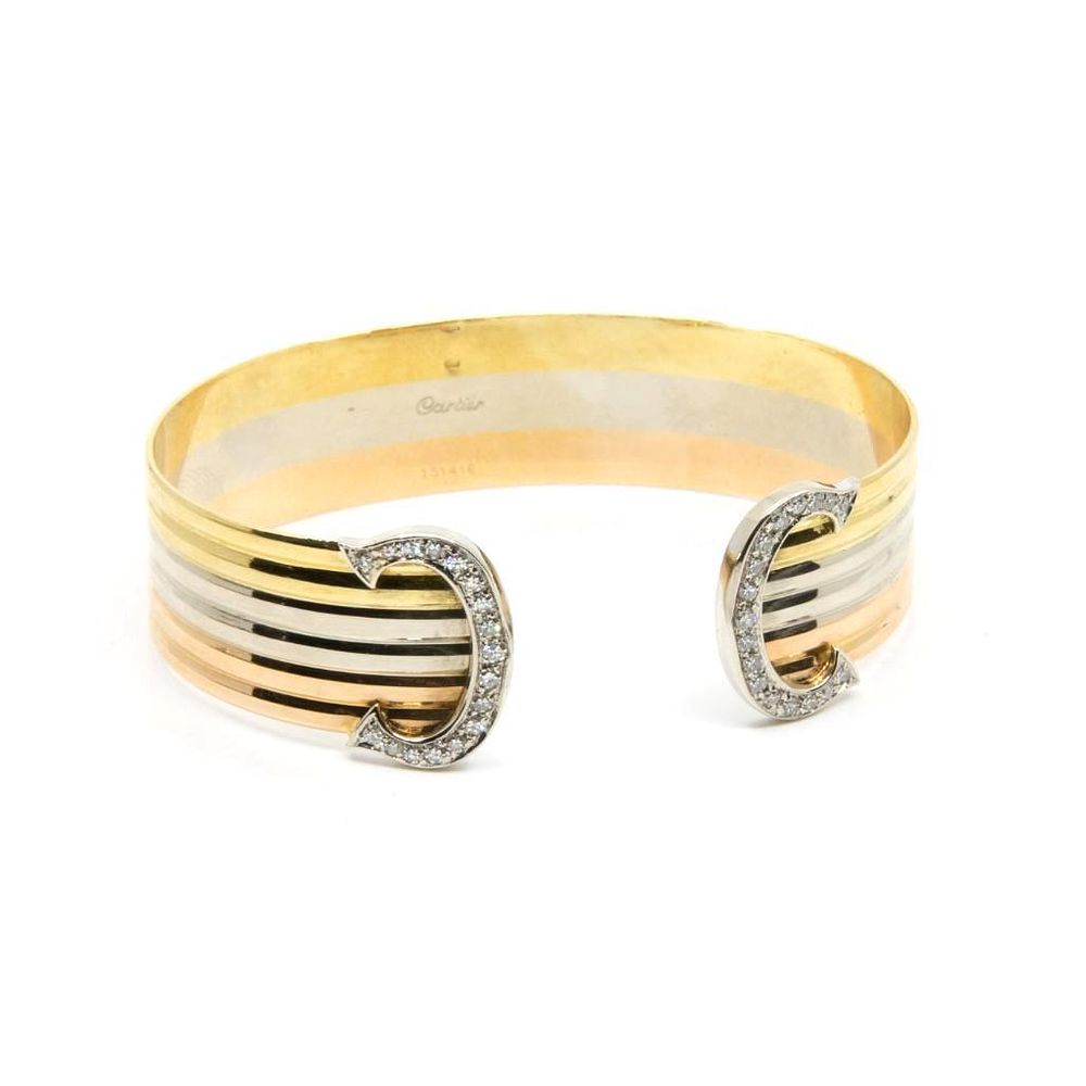 Lot 302: GIA Cartier tri-color 18kt gold Trinity diamond double