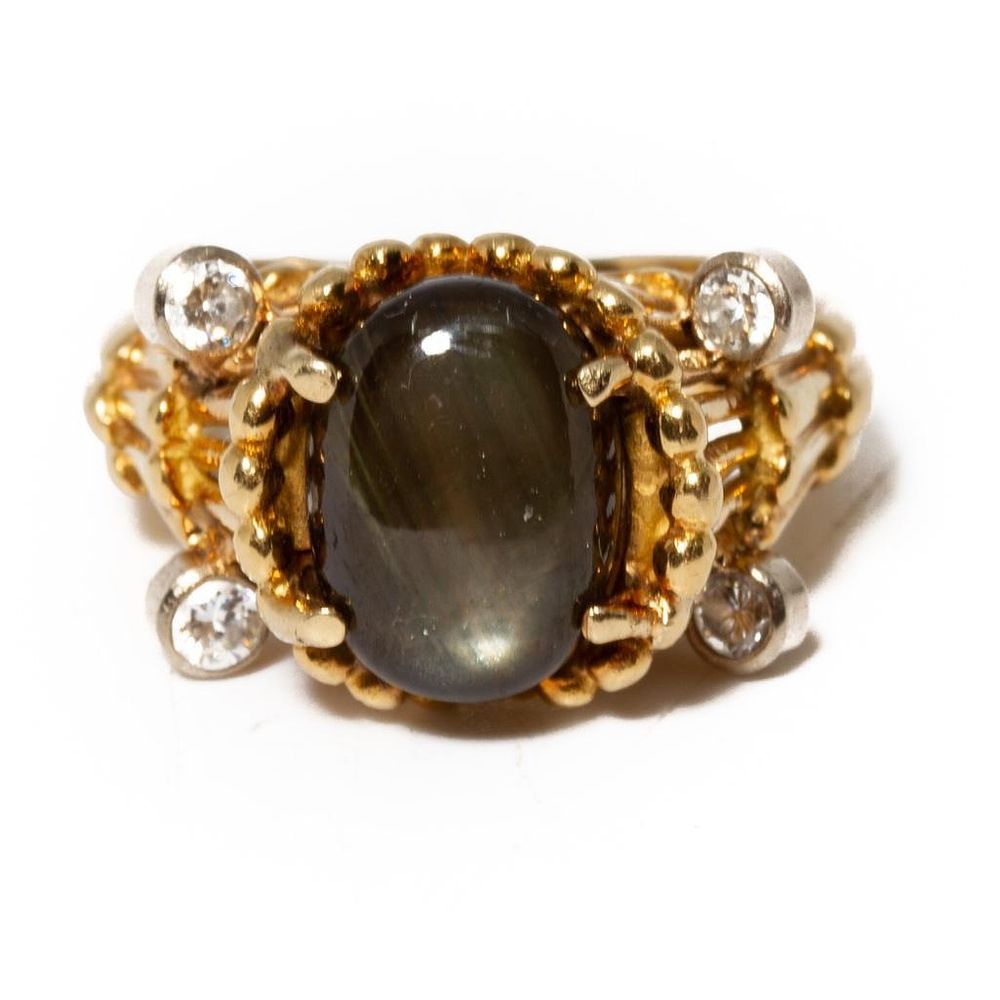 Lot 320: GIA 18K Gold, Black Star Sapphire and Diamond Ring