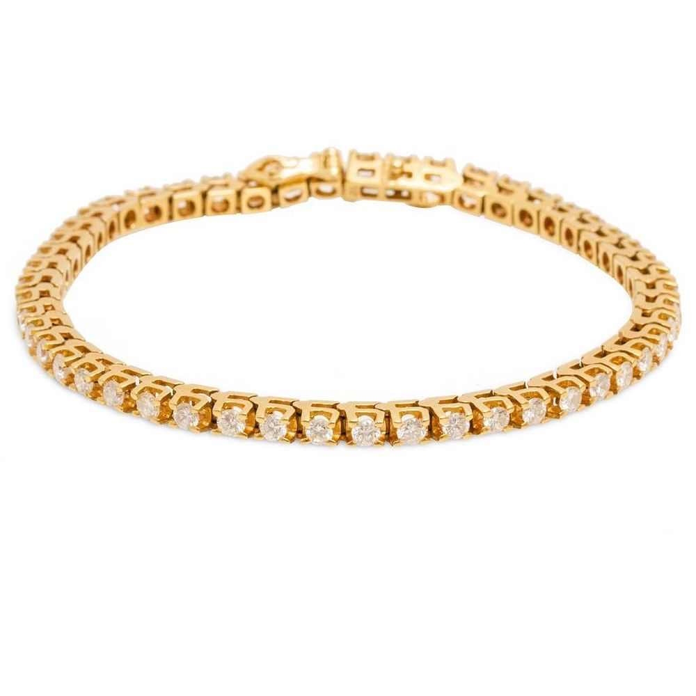 Lot 420: GIA 14k gold and diamond bracelet