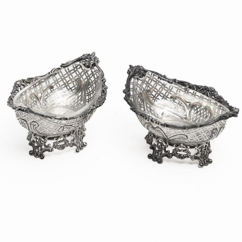 Lot 205: Sterling silver with cut glass insert footed nut dishes