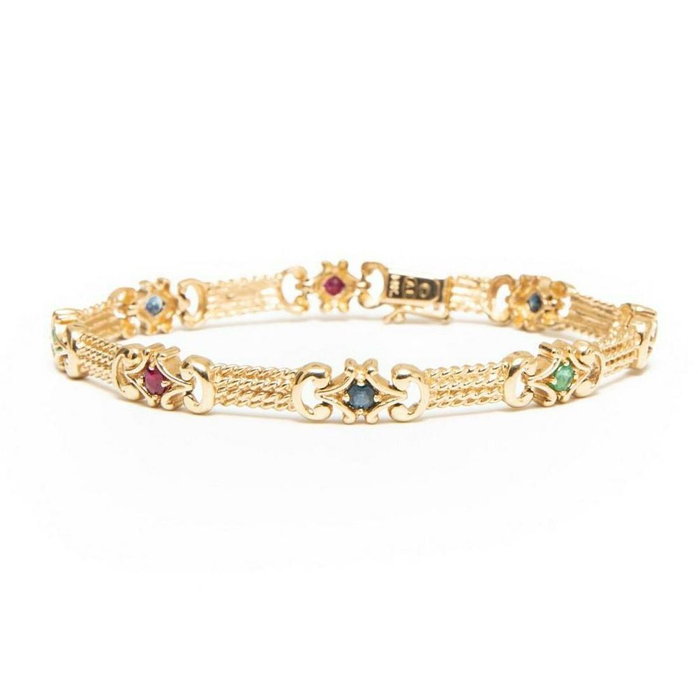 Lot 212: GIA 14k gold sapphire ruby and emerald gold strap