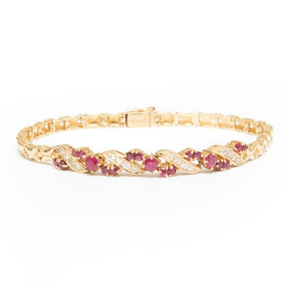 Lot 304: GIA 14k gold ruby and diamond bracelet