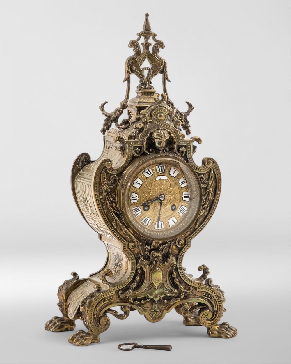 Lot 272: French 19th Century Bronze mantle clock. Rich decoration 16" tall