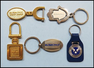 Lot of 5 EL AL airline metal keychains. (1) Gold oval keychain inscribed "EL AL 747-400". (2) 