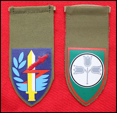 Lot of 2 IDF unit tags, printed on khaki cloth: (1) Signal Corps tag, blue shield with an 