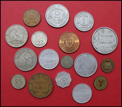 Lot of approximately 17 world coins. Includes Uganda (Bank of Uganda: 5, 10 and 20 cents and 