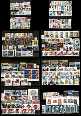 Lot of New Zealand stamps, 1975-1999, arranged by year in an album. The unused material is laid 