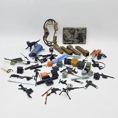 Action Figure Accessories Lot. Lot of assorted action figure accessories including:
Guns