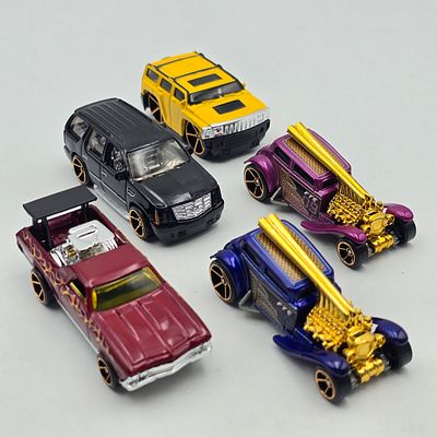 Hot Wheels Faster Than Ever lot of 5 
Mixed manufacturer lot here including Hummer, Chevy El 