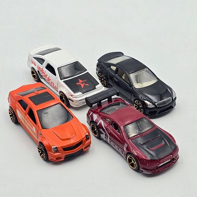 Hot Wheels FTE lot of 4. Hot Wheels Faster Than Ever FTE car lot of 4 
Includes Cadillac, Nissan 