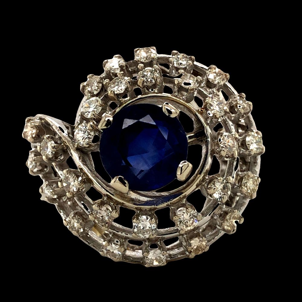 14K Diamond and Sapphire Ring. S/6.51-ASY 
This unique 14K white gold ring features a striking 