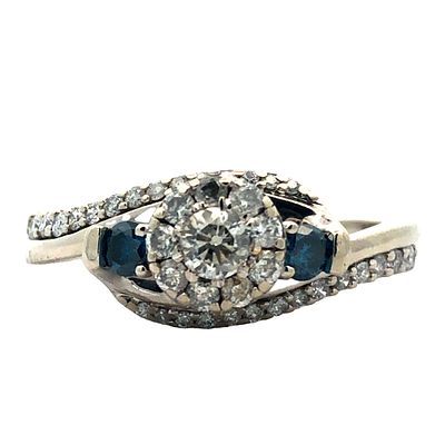 Blue & White Diamond Ring. S/3.8-NYS 
This elegant ring showcases a captivating design featuring 