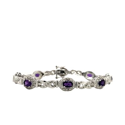 Purple Gemstone Bracelet . S/12.4-MOS 
A linked bracelet design where oval purple gemstones are 
