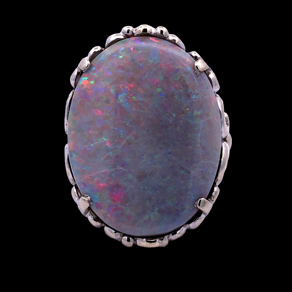 Australian Natural Black Opal Ring. S/8.8-KSS 
This magnificent cocktail ring, features a large 