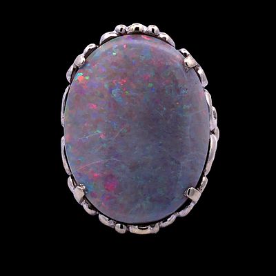 Australian Natural Black Opal Ring. S/8.8-KSS 
This magnificent cocktail ring, features a large 