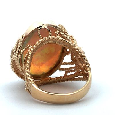 10.06 Carat Jelly Opal Ring. S/13-MOSS 
This enchanting ring showcases a magnificent water / 