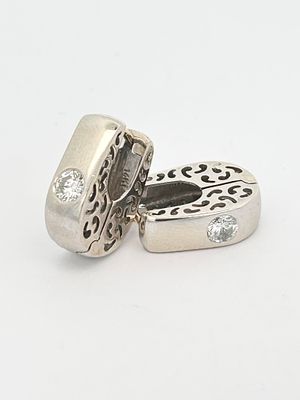 Diamond Huggie Earrings. S/6.3-TSS 
These chic huggie earrings offer a perfect blend of modern 