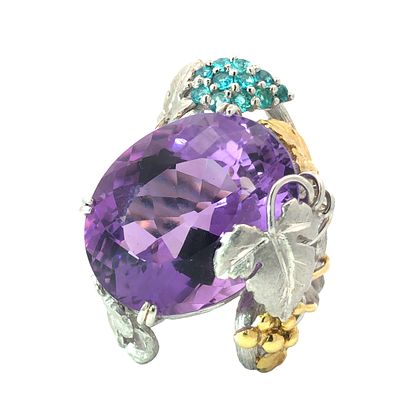 Unique Amethyst and Tourmaline Ring. IS2172/22-MMSS 
This unique and eye-catching ring features 
