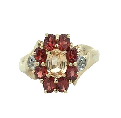 Multi Gemstone Cluster Ring. S/3.8-EYS 
This ornate ring features a central oval-cut 