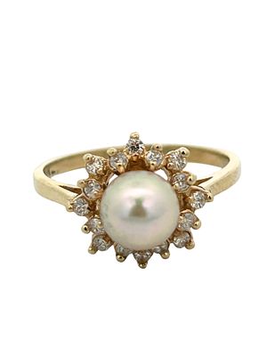 Pearl and Diamond Ring. This classic and radiant cocktail ring is crafted in warm 14-karat 