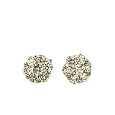 10K Diamond Cluster Flower Earrings. Presenting a lovely and sparkling pair of 10K White Gold 